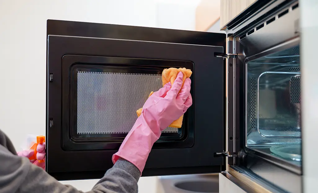 Clean Appliances, Such as the Oven, Microwave, and Refrigerator