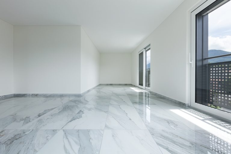 What is the disadvantage of marble flooring?